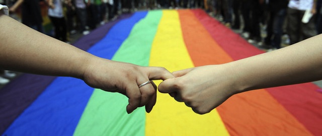 Gay and lesbian activists form a human c